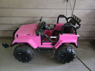 Ride on Jeep electric  with battery charger/ similar to a Power Wheel.