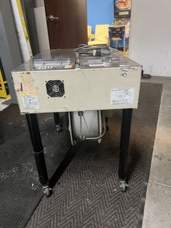 Semi Automatic Strapping Machine Plus Full Spool Of Plastic Wrap