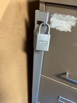 File cabinet security locking bracket