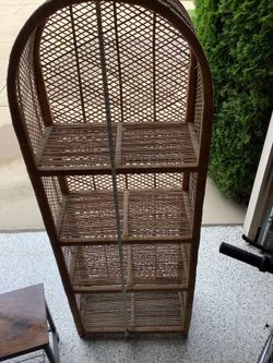 Vintage Rattan arched top cabinet, approximately 64” tall, 22” wide depth of shelves 13” height of each shelve 13”, excellent condition
