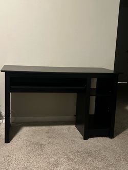 Black desk only little scuffs not noticeable from afar