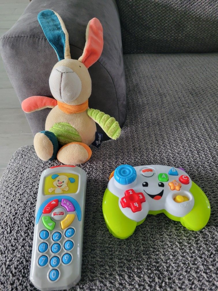 Fischer Price Light Up Talking Video Game Controller And A Musical Rabbit And A Fisher Price Remote Control