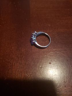 Size 7 wedding ring.band is real but the diamond are not.asking $70