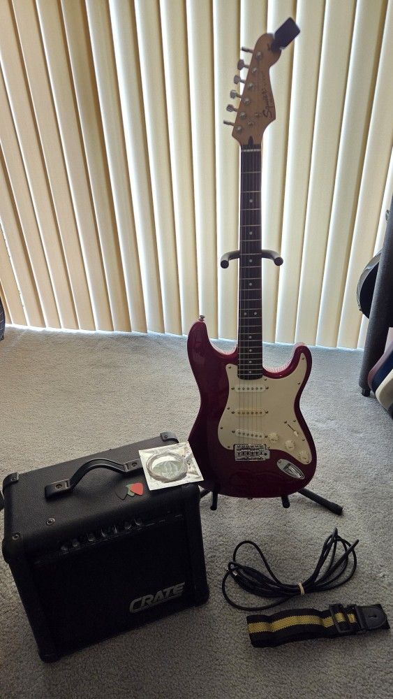 Fender Squire Affinity Guitar, Crate Amp, Cable, Strap, Picks, Extra Strings and Headstock Tuner