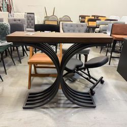 Brand new console table with black metal legs and brown wood top 