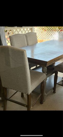 Counter hind dining room table with extension and 4 chairs