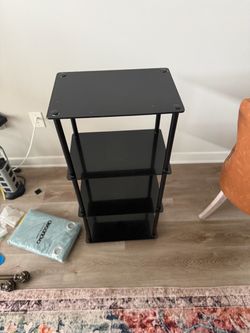 Black 4 tier glass shelf 39in H 17in D 14in W