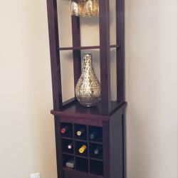 This piece is a corner bar cabinet or wine tower, commonly referred to as a:

> Corner Wine Cabinet with Glass Rack & Bottle Storage


