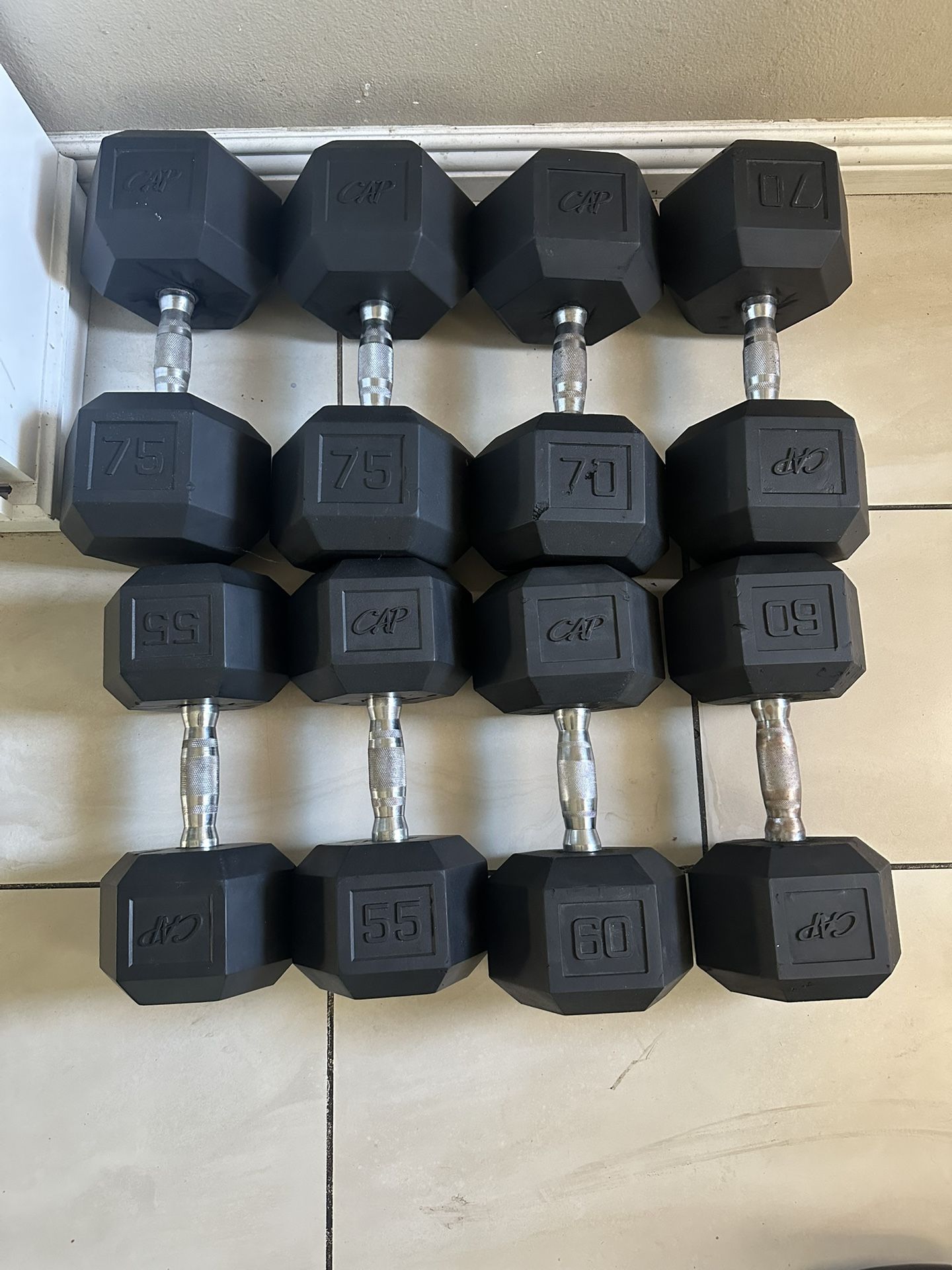 Pairs of 55,60,70,75 rubber hex dumbbells weights 520lbs total prices are in the description