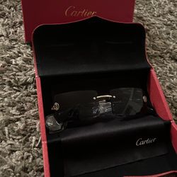 Black and gold tinted Cartier Glasses