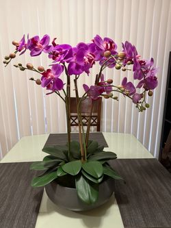 Artificial orchid in a vase.