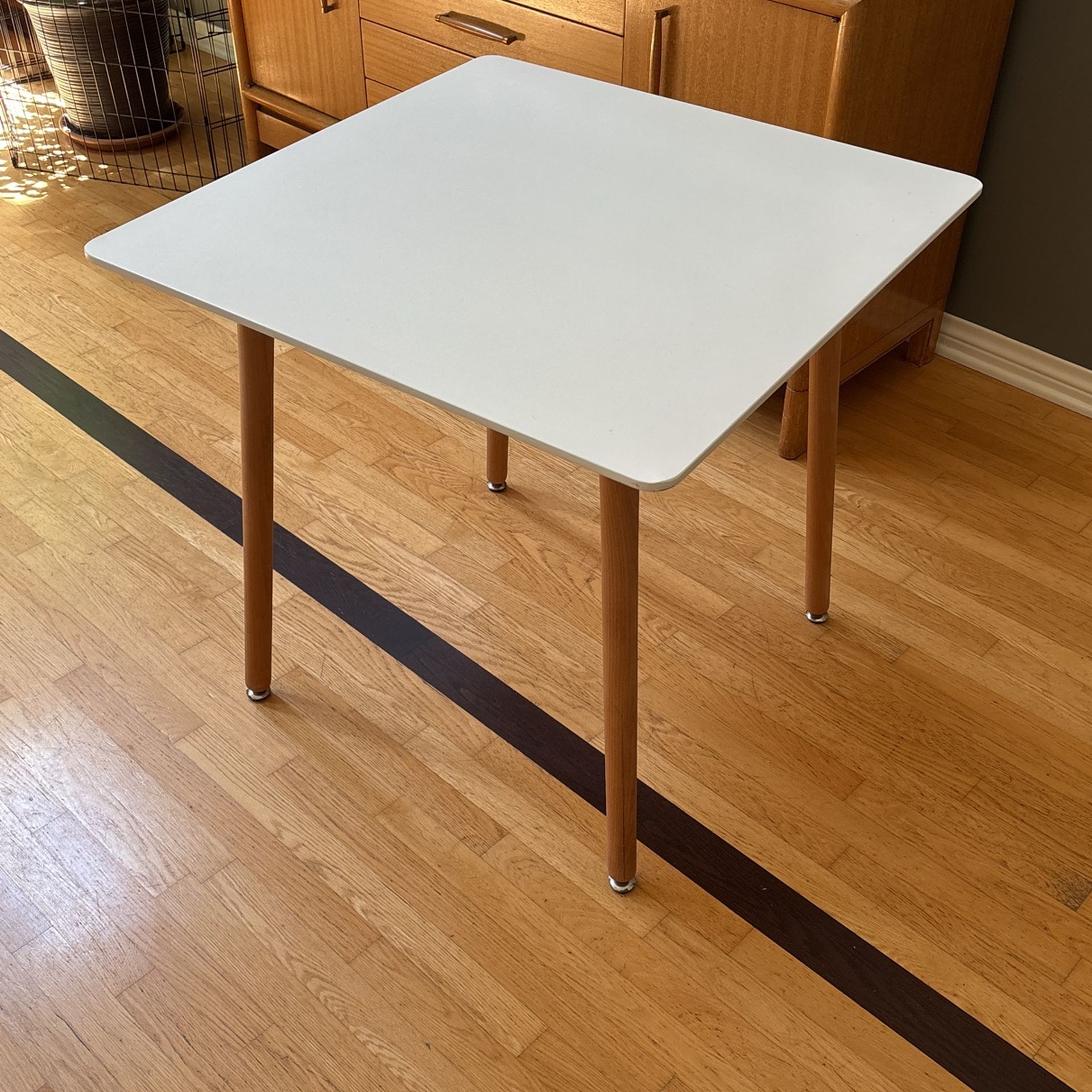 Modern Square Breakfast Table With White Top And Wooden Legs