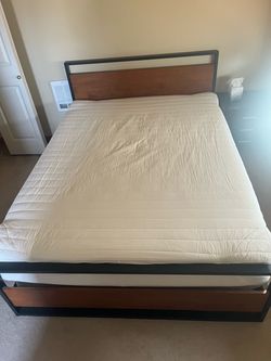 Queen bed frame with mattress and box spring