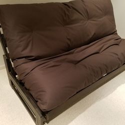 Full size solid wood futon includes deluxe foam core mattress