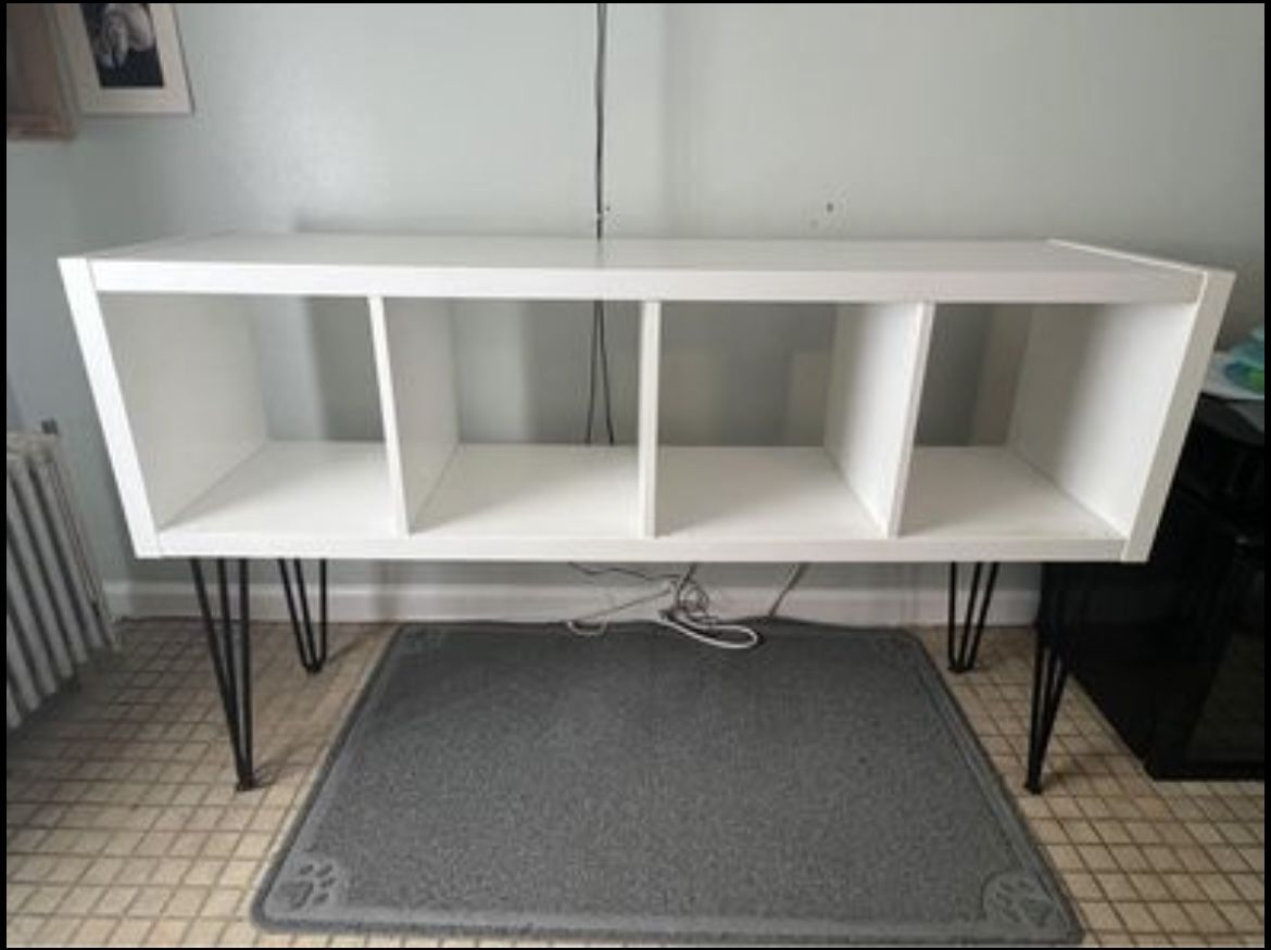 white Kallax shelf unit with sturdy black hairpin legs