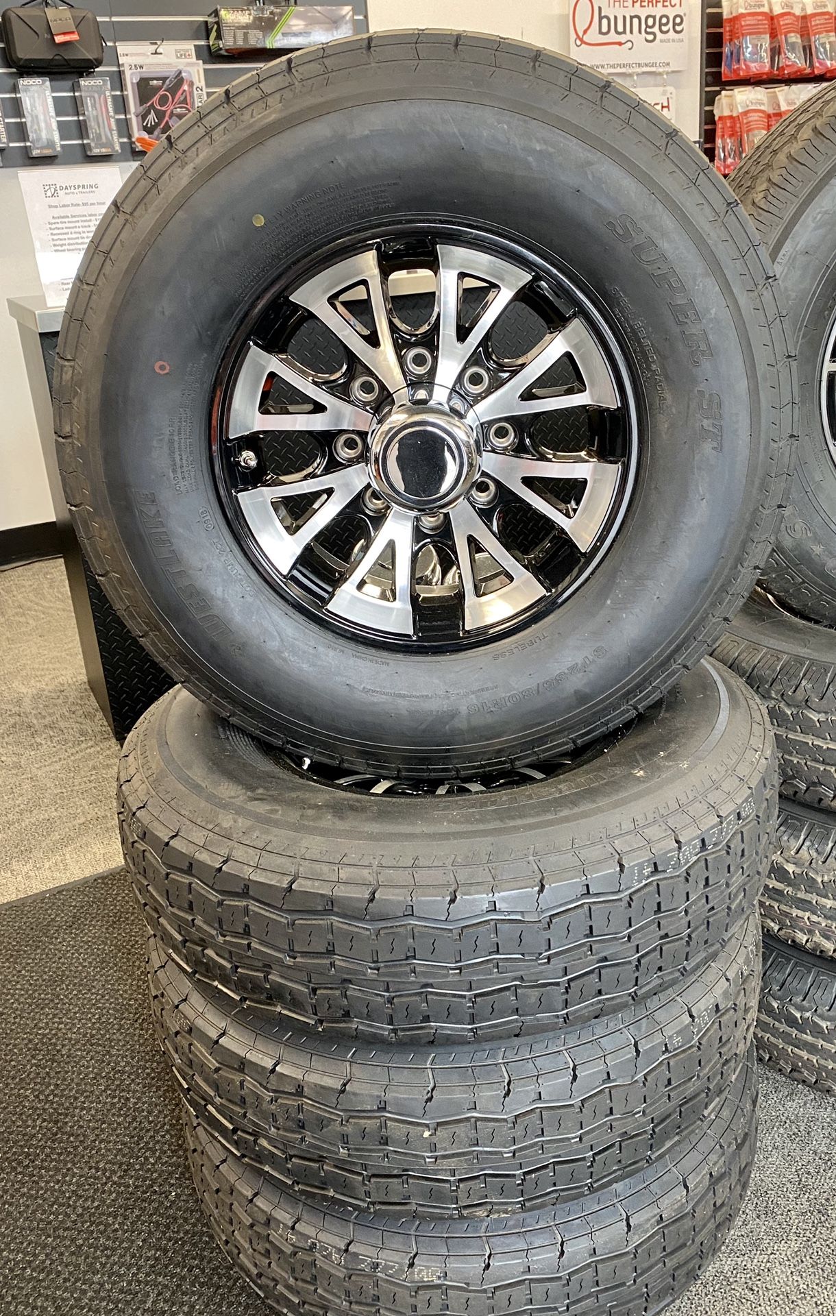 Set of (4) ST235/80R16 tires w/ 8 lug Aluminum wheels w/ center caps