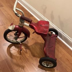 Vintage red child’s riding Junior toy division AMF tricycle