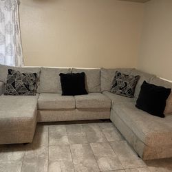 Grey U shaped Couch