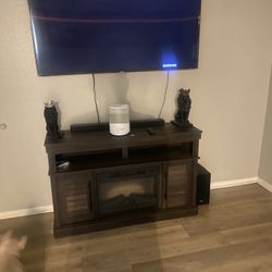 65’ Curve TV And electric Fire Plac