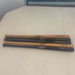 Miniature baseball bats from the college World Series