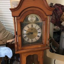 Grandfather clock with. Ross weights