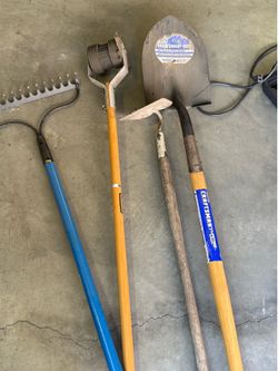 Gardening tools. Shovel, metal rake, hoe, edger