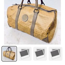 VINTAGE FENDI MEDIUM DUFFLE BAG WITH SIGNATURE PRINT!!! GREAT COLLECTORS ITEMS & TRAVEL STATEMENT PIECE- MAKE IT YOURS TODAY!!!!