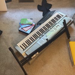 Piano With Stand and Instructions Books