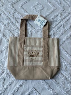 BRAND NEW with tag , Trader Joe’s striped new release mini tote bag in beige/tan color