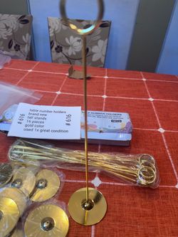Table Number Centerpiece Holder. Set of 16 pieces, 12” tall. Gold color- add your own sign.
