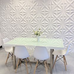 Modern table & 6 chairs,  sturdy metal base , glass top 