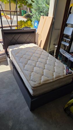 Twin bed with built in lighting and storage