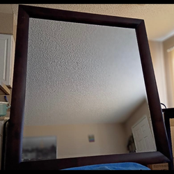 Medium to large Wall Mirror; minor imperfections..  Price negotiable