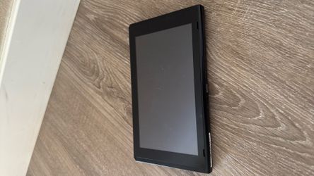 Nintendo switch 1 with micro sd card, black pro controller, and 5 games