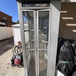 Vintage payphone booth and payphone.