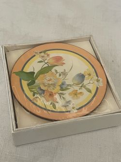 A set of six English Life Angelique cork coasters with a floral and bird motif.