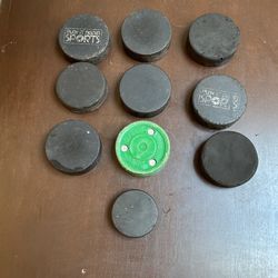 11  Practice Hockey Pucks 