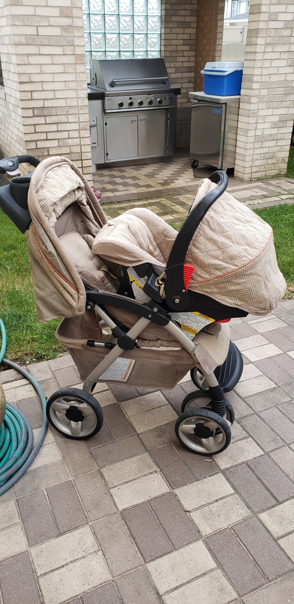 Eddie Bauer stroller with carrier and car seat.