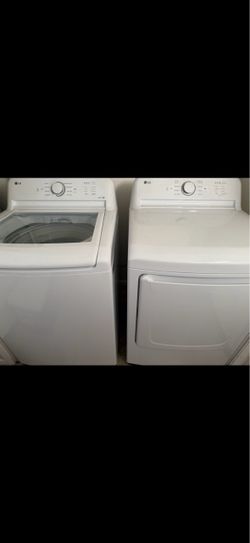 White LG High Efficiency Energy Saver Top Load Impeller Washer and Front Load Dryer Set