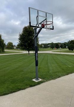 Goaliath 54 inch in ground basketball hoop, adjustable basketball court