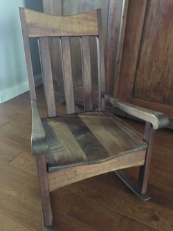 Red wood rocking chair