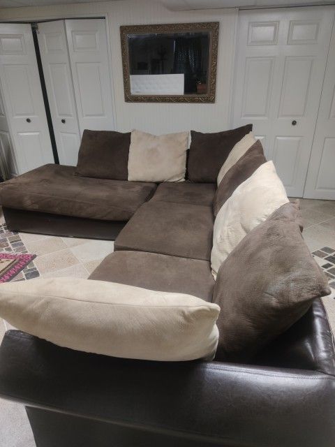 brown sectional sofa with a chaise lounge. Bought $3000