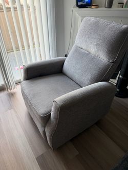 360° Swivel Rocker Recliner. Near-Flat Recline