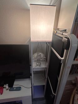 Two white wooden floor lamps