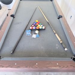 Pool Table with Balls and Cues