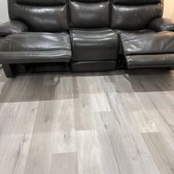 Dark grey 84in wide reclining couch