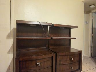 Two nightstands with a light under