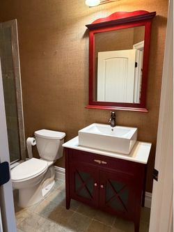 Bathroom vanity with mounted sink and faucet