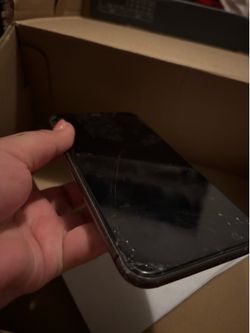 Beat up black iPhone 11