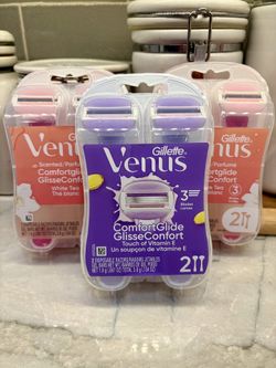 Gillette Venus ComfortGlide disposable razors. Each pack contains 2 razors with 3 blades and moisture bars. White Tea scented packs OR Touch of Vitami